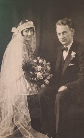 Leonard Kleinhenz and Helen (Kleinhenz) Russell Wedding Photo Lima Ohio. December 27, 1928. Source: Susan Kleinhenz Holland.

DR. L. A. KLEINHENZ AND MISS HELEN RUSSELL TODAY ARE MARRIED IN LIMA

Dr. Leonard A. Kleinhenz, son of Mr. and Mrs. John W. Kleinhenz, of this city, and Miss Helen Russell, of Worthington, were married at 8 o’clock this morning at the St. Gerard Catholic church, in Lima, with the Rev. Patrick Murphy officiating. The bridegroom was attended by his brother, Arnold, who is a student at Ohio State university. Miss Lucille Link, of Monroeville, also a student at Ohio State university, acted as bridesmaid.

The bride’s gown was of white satin and her veil was of tulle. She carried an arm bouquet of roses and baby breath. Her bridesmaid wore a gown of green crepe with a hat of harmonizing color. She also carried an arm bouquet of roses and baby breath.

Among those to witness the beautiful ceremony were Mr. and Mrs. John Kleinhenz, Ray Kleinhenz, Miss Elfreda Kleinhenz, Miss Pauline Kleinhenz, Miss Esther Kleinhenz, Edwin Kleinhenz, of St. Marys; George Thieman, of Minster; Rev. Sebastine Cramer, of Cleveland, an uncle of the bridegroom, Mr. and Mrs. Wiemer and Mrs. Cole, of Worthington, Mrs. Calahan, of Lima.

Following the nuptials, the bridal party and a group of relatives and close friends went to the Hotel Argonne, where a wedding breakfast was served.

During the afternoon Dr. and Mrs. Kleinhenz left on a wedding trip to New York City, and on their return will live in Lima.

The bride is a daughter of Frank Russell, of Worthington. She is a graduate of Ohio State university and for the last year she has been a teacher of home economics at the high school in Wauseon.

The bridegroom is a graduate of the medical college at Ohio State university and is now serving an internship at the St. Rita’s hospital in Lima.

Both Dr. and Mrs. Kleinhenz have many friends who are extending best wishes and congratulations to them.

St. Marys, Ohio, Evening Leader Newspaper, December 27, 1928 - Page 6